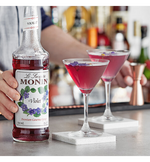 Load image into Gallery viewer, Monin Premium Violet Flavoring Syrup 750 mL

