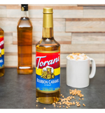 Load image into Gallery viewer, Torani Bourbon Caramel Flavoring Syrup 750 mL
