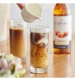 Load image into Gallery viewer, Capora Caramel Flavoring Syrup 750 mL
